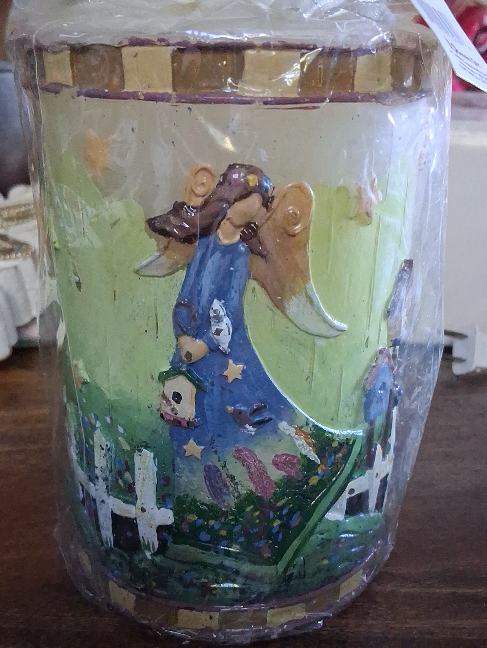 folk-art style angel relief pillar candles